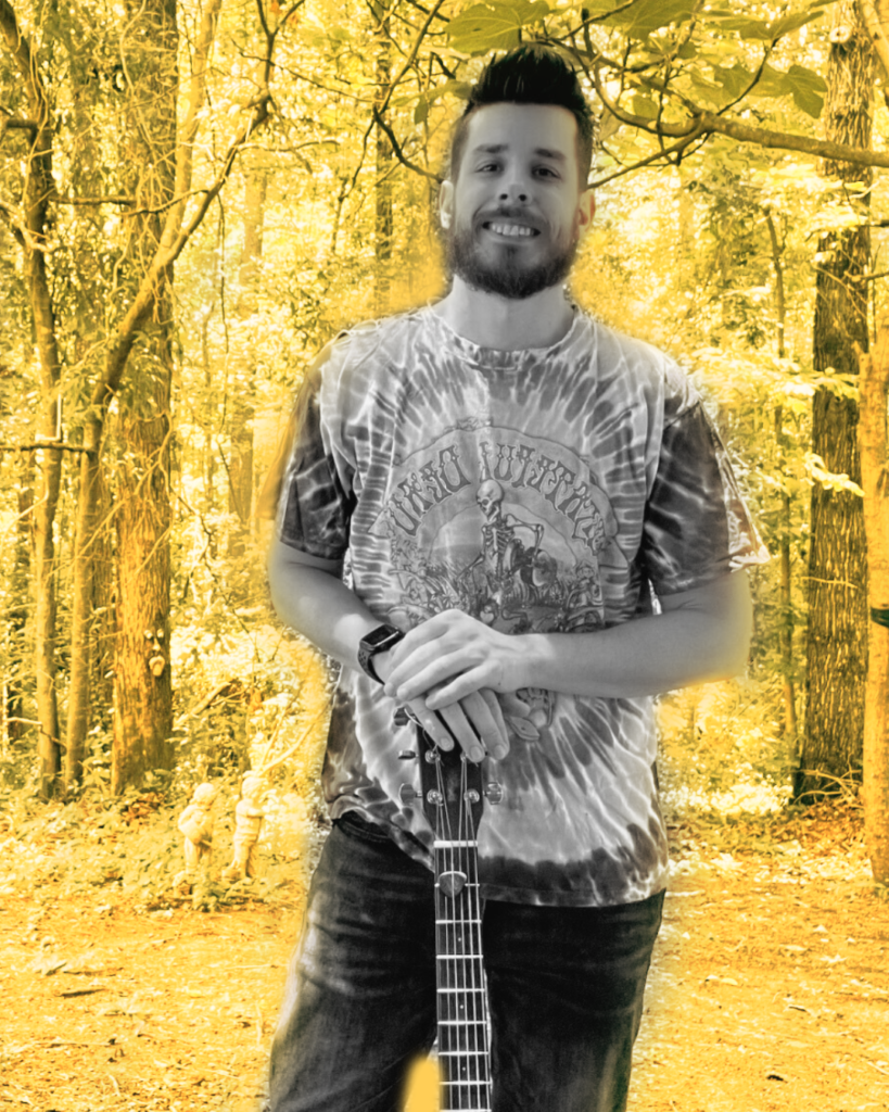 photo of person with a guitar